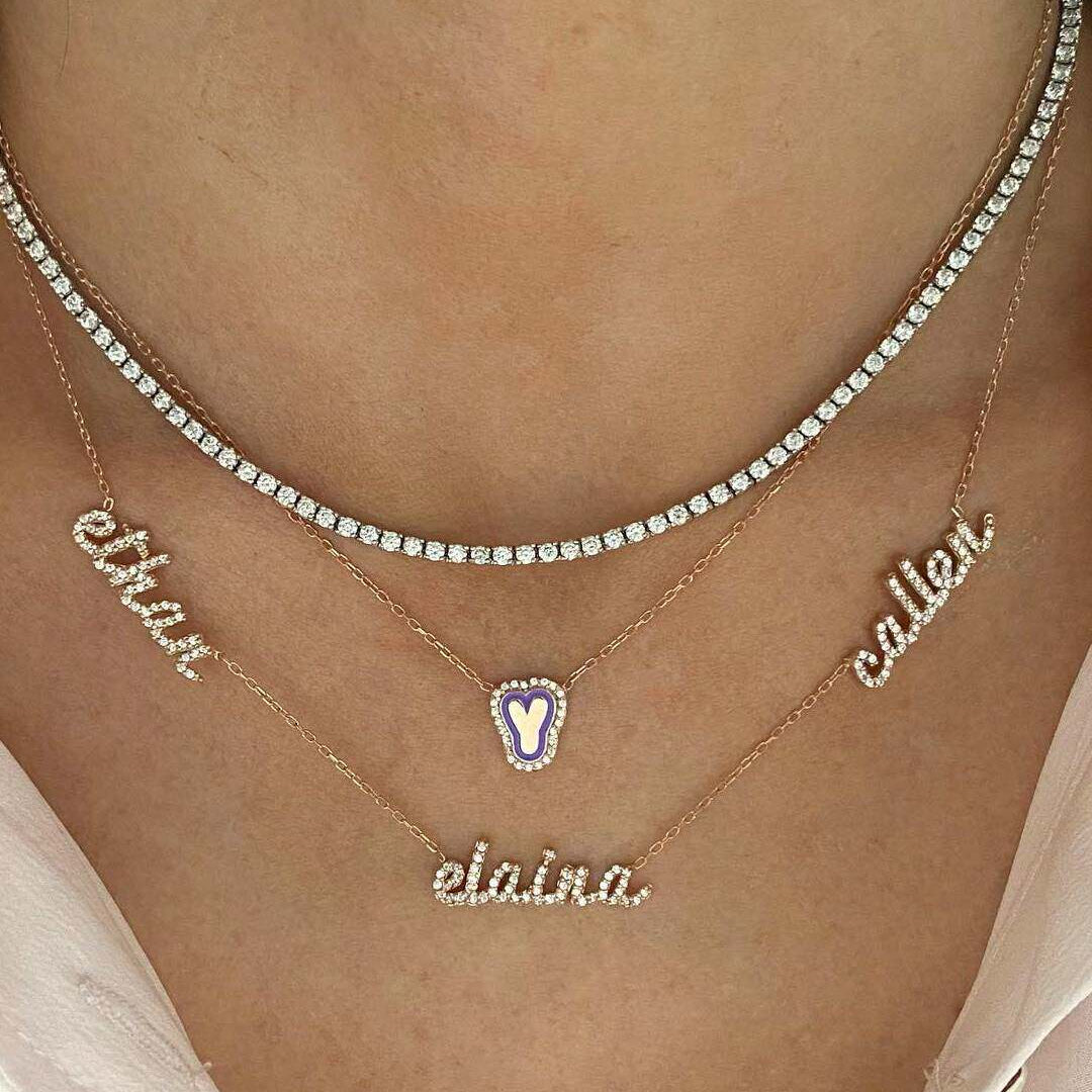 Necklace with name pendants on a person's neck