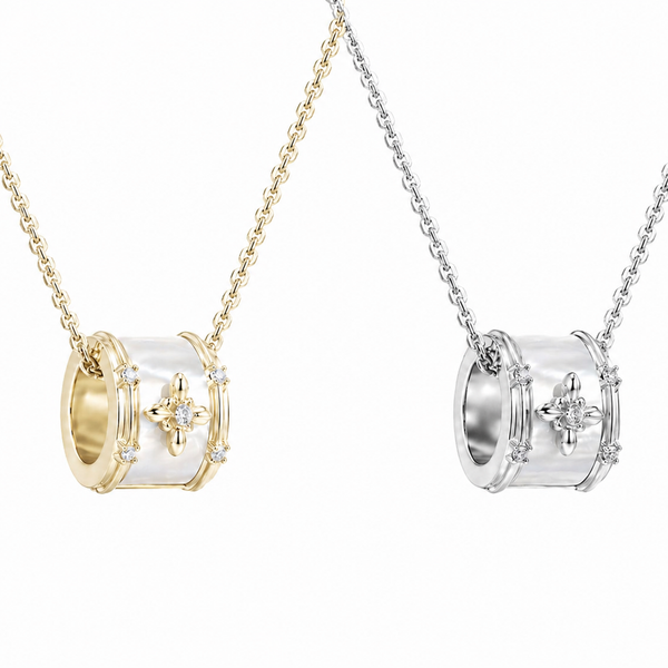 Two necklaces, one gold and one silver, on a white background
