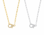 Two necklaces, one gold and one silver, with similar pendants 