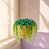 Classic green beaded hanging plant DIY kit in a sunlit cream and lavender room
